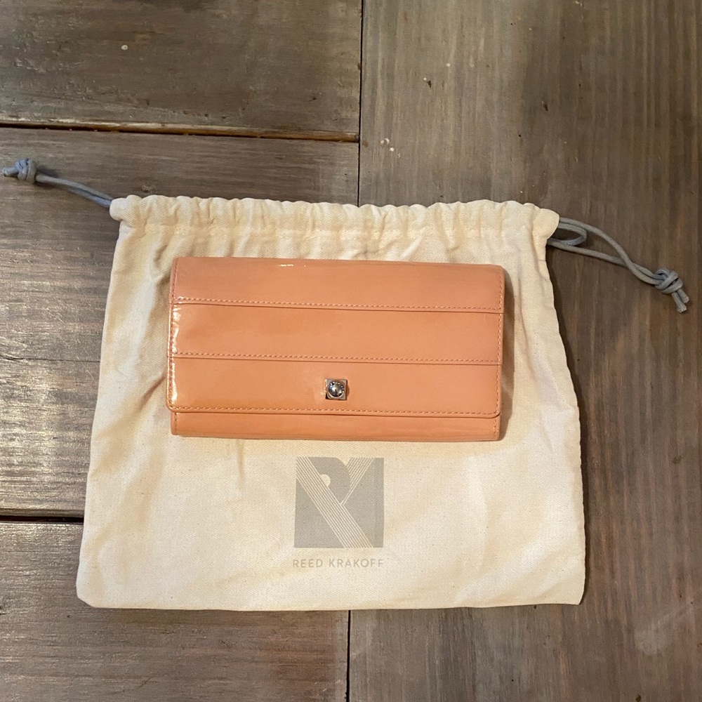 LIKE NEW light salmon/blush wallet with silver leather interior. With dustbag.